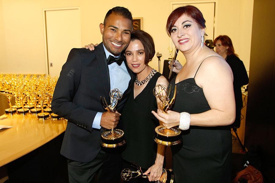 Members of the NBC News 4 team celebrate backstage at the 66th Los